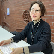 Academic Gigi Choi sat at table